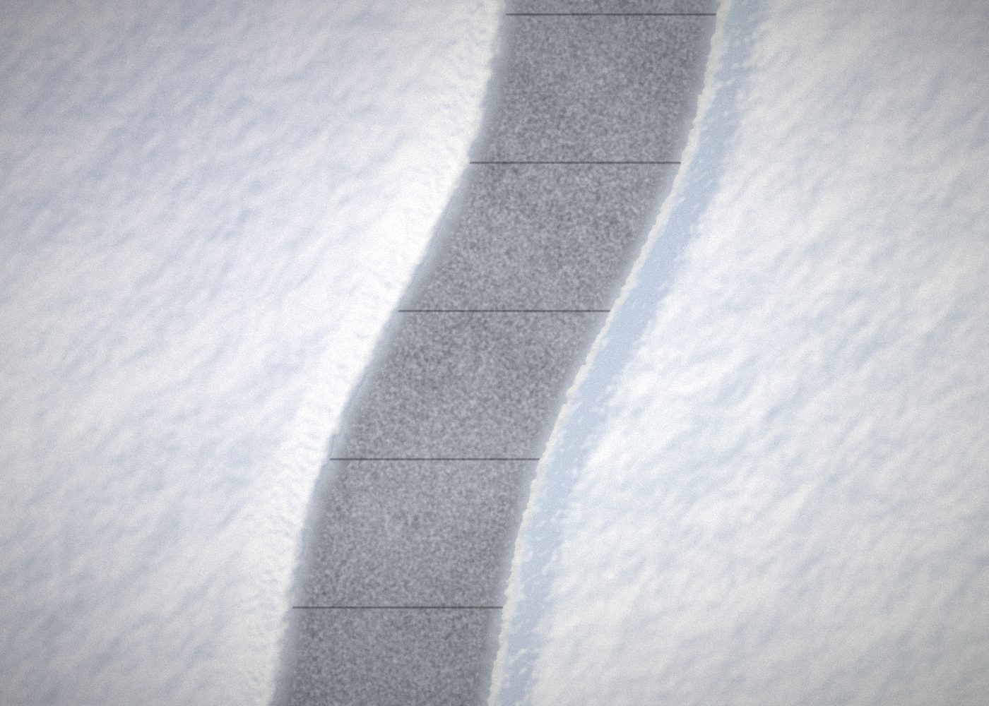 Snow cleared from a walkway, with snow banked on both sides